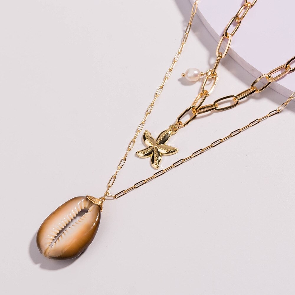 achat collier cauri étoile