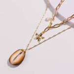 achat collier cauri étoile