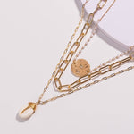 achat collier médaillon cauri