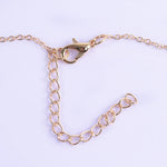 collier coquillage mousqueton