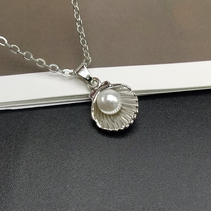 Bijou perle de coquillage