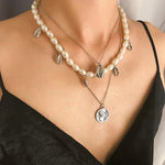 collier avec coquillage porcelaine