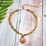 collier avec pendentif coquillage