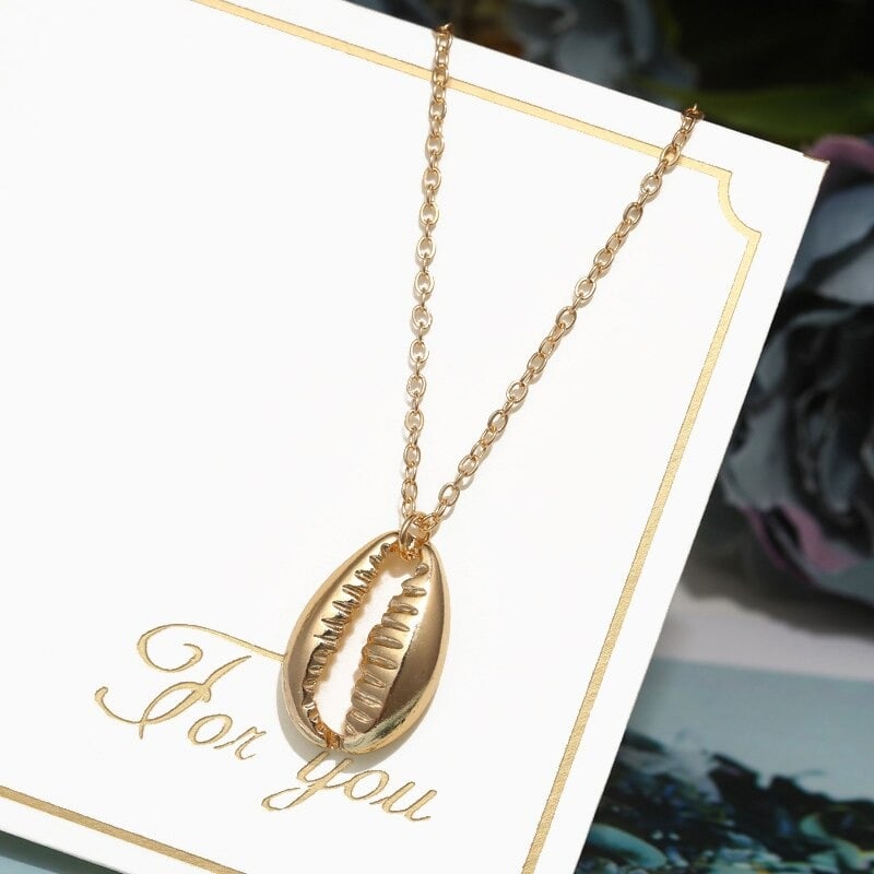 collier cauri couleur or