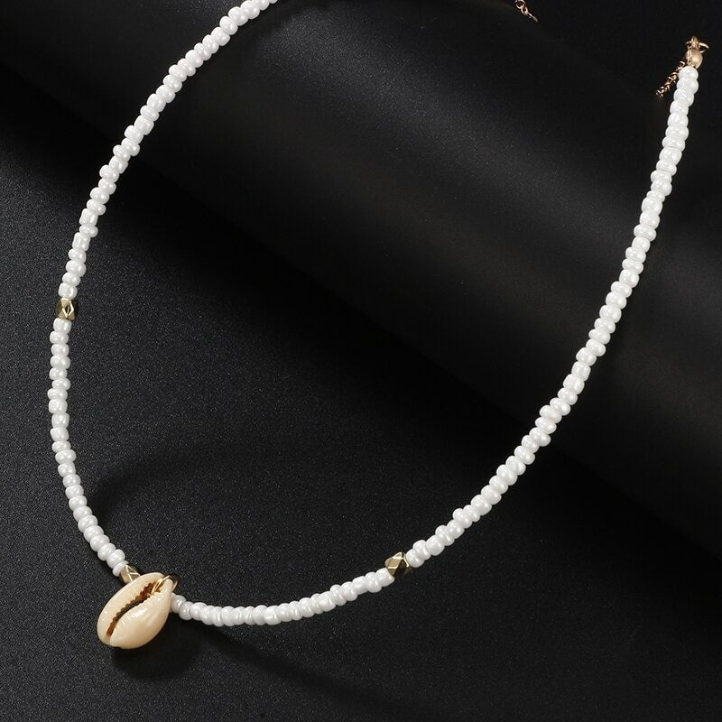 Collier coquillage blanc doré