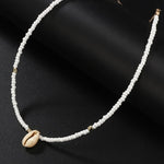 Collier coquillage blanc doré