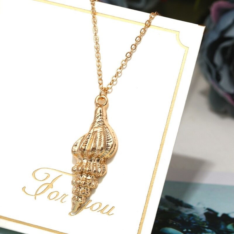 collier coquillage couleur or