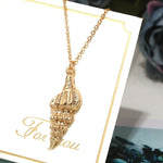 collier coquillage couleur or
