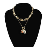 collier coquillages doré