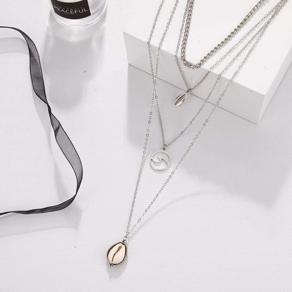 collier femme vague