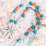 collier fleur cauri