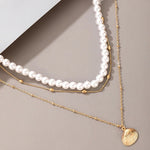 Collier au pendentif coquillage