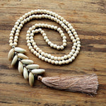collier perle cauri