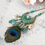 collier plume coquillage