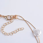 collier médaille nacre coquillage