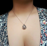 Pendentif perle de coquillage